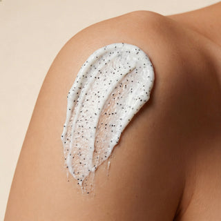 Vicqua Icelandic Volcano Face & Body Scrub texture applied on shoulder showing volcanic particles